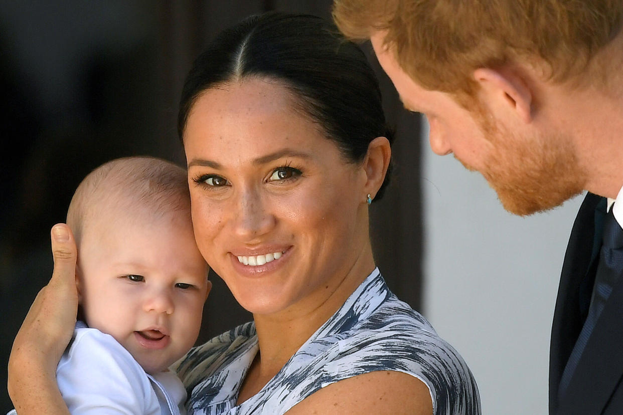 Britain's Prince Harry and his wife Meghan, Duchess of Sussex holding their son Archie, meet Archbishop Desmond Tutu (not pictured) at the Desmond & Leah Tutu Legacy Foundation in Cape Town, South Africa, September 25, 2019. Reuters Photographer Toby Melville: ''I took this photograph during The Duke and Duchess of Sussex's official tour in southern Africa, across a courtyard balcony as they met Nobel-prize-winning civil rights activist Archbishop Desmond Tutu. Though Tutu is not in this frame, the presence of this magnetic personality I think put both Meghan and Harry at ease. Technically the image is helped by the bright sunlight which bounced around the white courtyard walls and lifted the details in Archie and Meghan's facial features, particularly in Meghan's eyes, and made the photograph more arresting. This was the first 