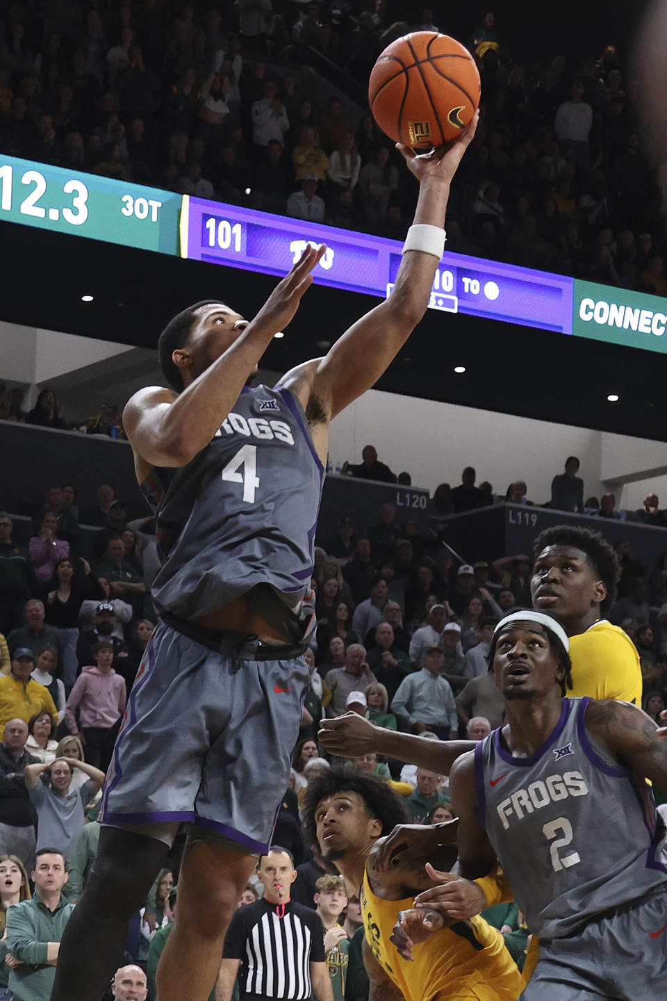 TCU guard Jameer Nelson Jr. (4) scores in triple overtime during an NCAA college basketball game Saturday, Jan. 27, 2024, in Waco, Texas. (AP Photo/Jerry Larson)