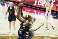 Marquette forward Liza Karlen (32) battles for a rebound against Connecticut forward Aaliyah Edwards, center, in the second quarter of an NCAA college basketball game Monday, March 1, 2021, in Storrs, Conn. (David Butler II/Pool Photo via AP)