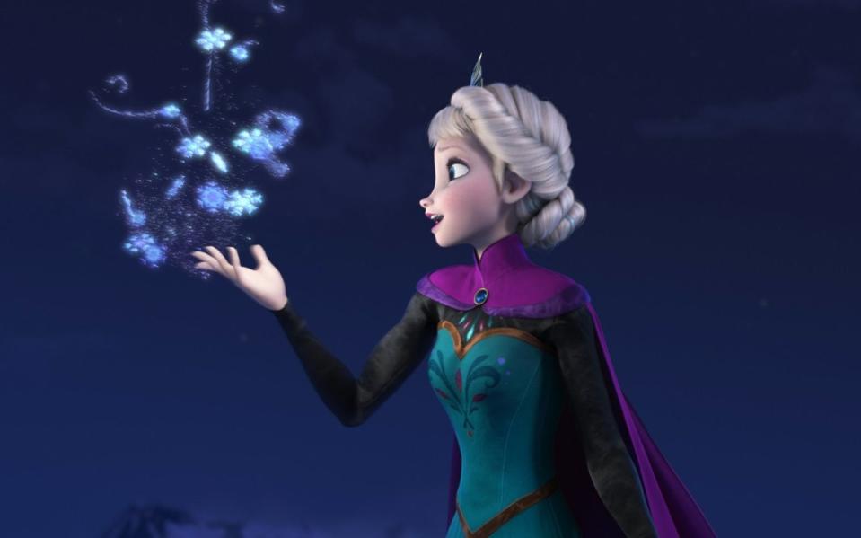 Queen Elsa, voiced by Idina Menzel, in Frozen, testing out her ice magic powers