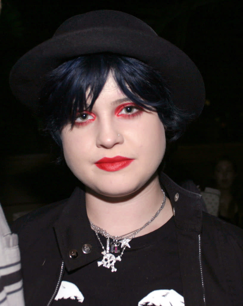 closeup of kelly in dark clothes and heavy goth makeup