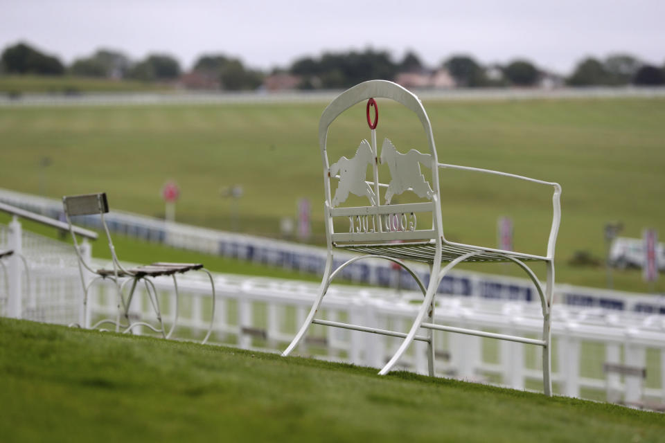 A view of empty seating at Epsom Racecourse, in Epsom, England, Saturday July 4, 2020. The Derby annual horse race will take place at the Epsom Downs Racecourse behind closed doors Saturday amid the coronavirus pandemic. (David Davies/PA via AP)