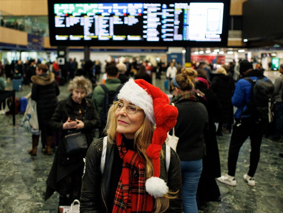 Passengers wait for train services from Euston Station (EPA)