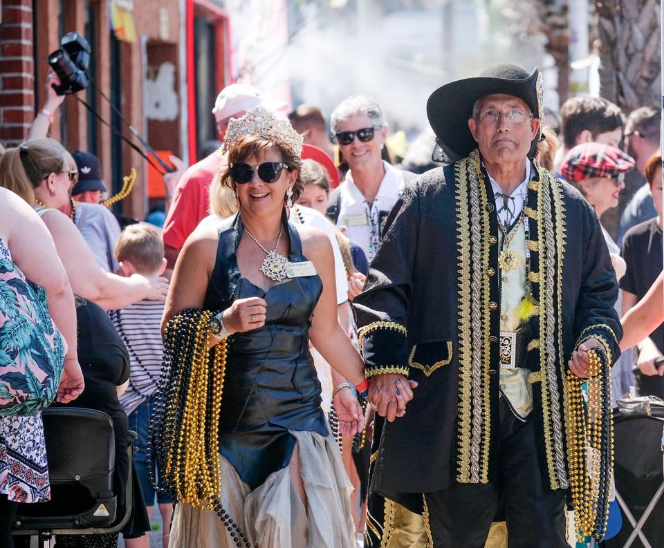 Pirate Queen Elizabeth Beck Noble England and Capt. Billy Bowlegs LXV Buddy Carter greet people alas they walk along Miracle Strip Parkway during the 65th annual Billy Bowlegs Festival in downtown Fort Walton Beach.