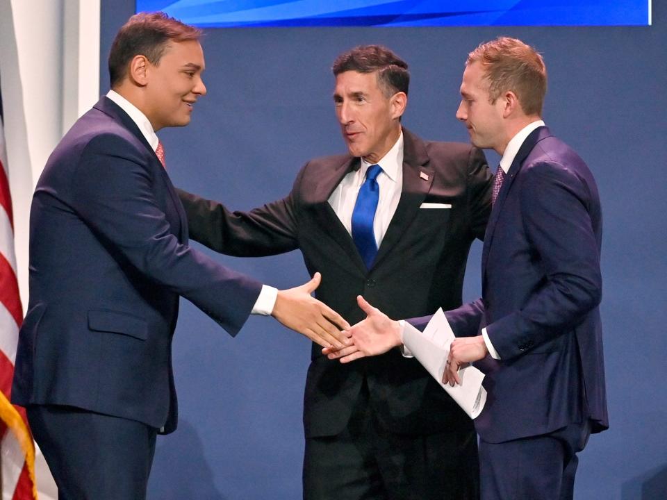 Kustoff embraces Santos and Miller at the Republican Jewish Coalition Annual Leadership Meeting in Las Vegas on November 19, 2022.