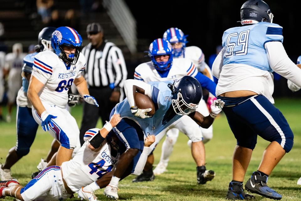 Keystone Heights' Damien Dunlap (44) tackles P.K. Yonge's Corinthian Graham (2).