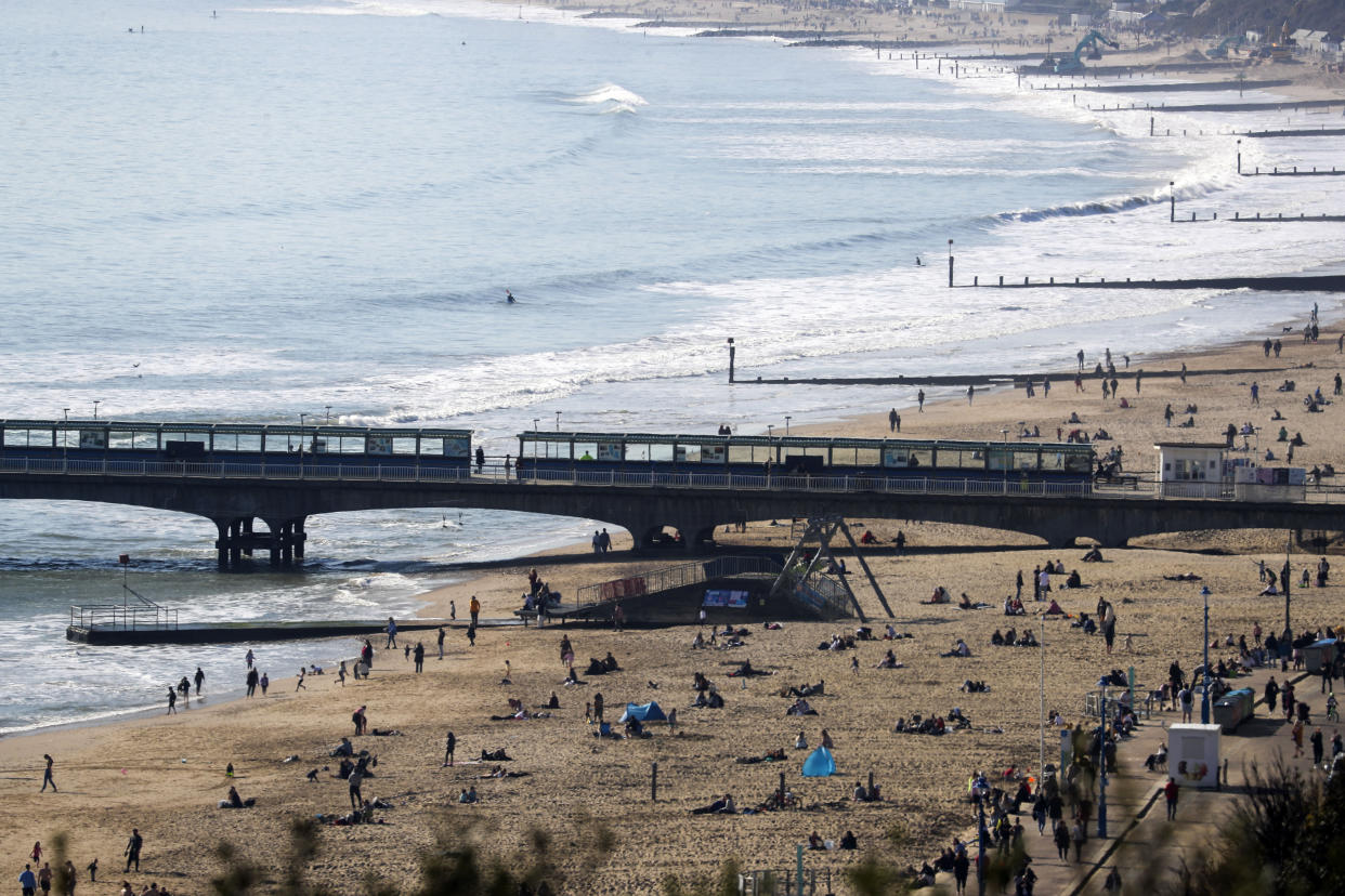 People enjoy the sunshine on Bournemouth beach, Dorset. Picture date: Saturday February 27, 2021.