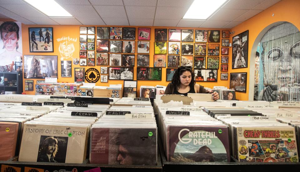 Kaitlyn Quezada of Peekskill browses vinyl record albums at Clockwork Records in Hastings-on-Hudson Sept. 14, 2023. For the first time since 1987, more vinyl albums were sold in 2022 than CDs.