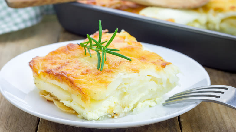 A slice of scalloped potatoes on a plate