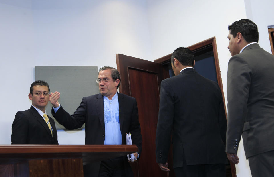 Ecuador's Foreign Minister Ricardo Patino, second from left, gestures after giving a news conference where he announced that Ecuador would grant asylum to WikiLeaks' founder Julian Assange, in Quito, Ecuador, Thursday, Aug. 16, 2012. The announcement comes two months after Assange took refuge in its London embassy to avoid extradition to Sweden to face questioning for alleged sexual misconduct. (AP Photo/Dolores Ochoa)