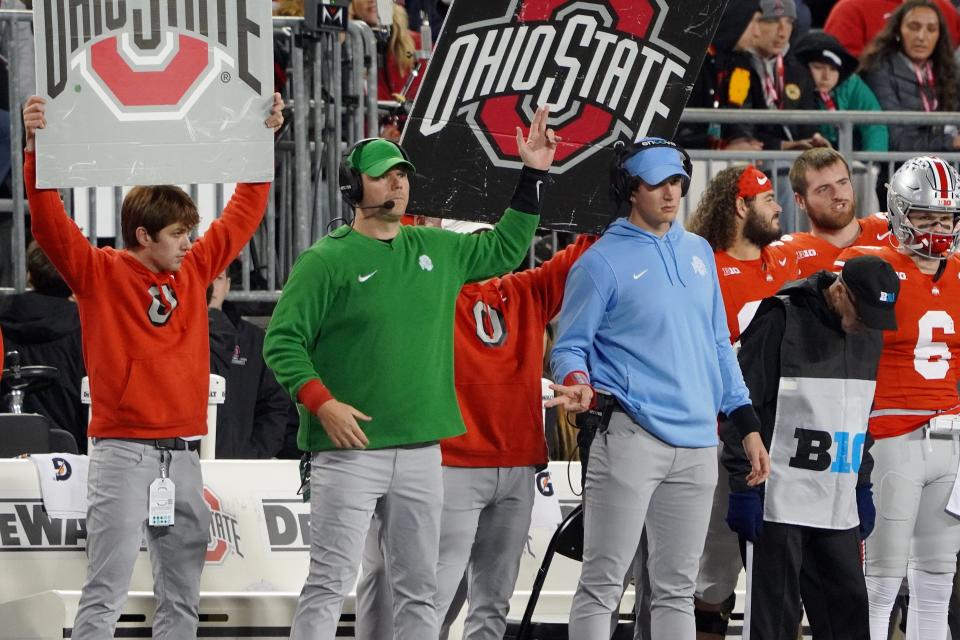 Ohio State signals in a play during the Buckeyes' 37-3 win over Minnesota.