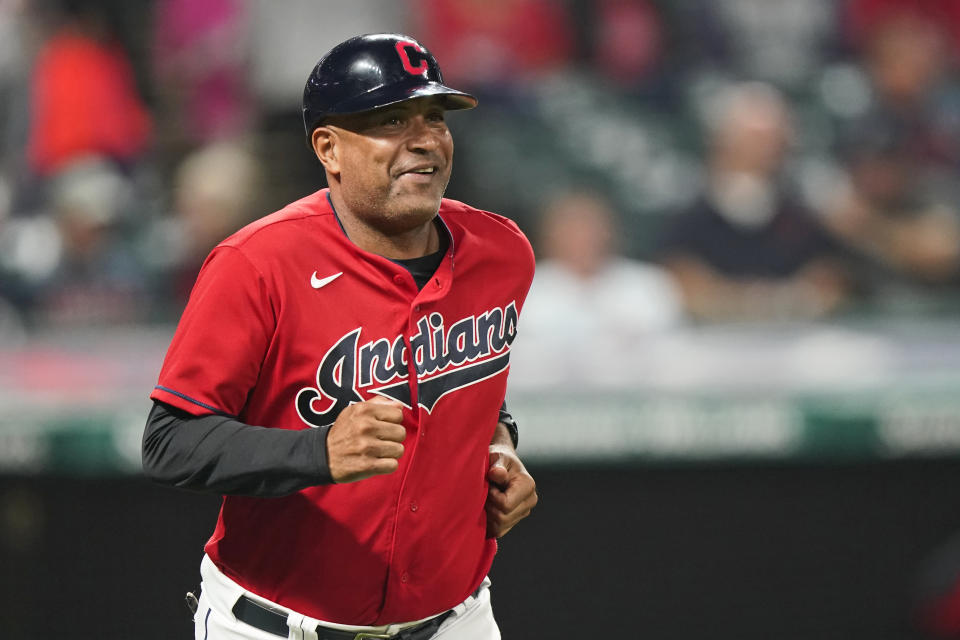 Cleveland Indians first base coach Sandy Alomar Jr. runs out on the field during a baseball game against the Kansas City Royals, Tuesday, Sept. 21, 2021, in Cleveland. On Sunday, one of the American League's charter members will play its final home game of 2021, and also its last at Progressive Field as the Indians, the team's name since 1915, when "Shoeless" Joe Jackson was the starting right fielder on opening day. Much more than a late-season matchup against the Chicago White Sox, the home finale will signify the end of one era and beginning of a new chapter for the team, which will be called the Cleveland Guardians next season. (AP Photo/Tony Dejak)