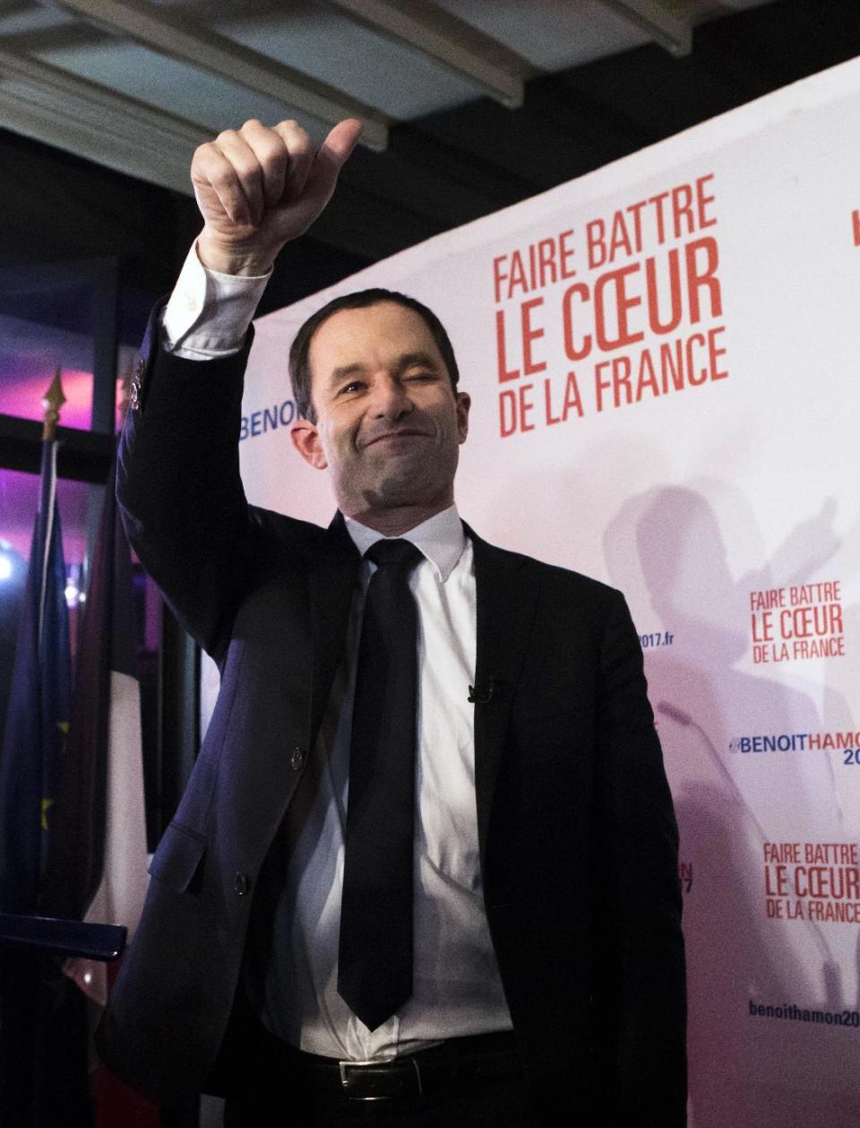 Candidate for the French left's presidential primaries ahead of the 2017 presidential election, Benoit Hamon, gives thumbs up while addressing his supporters at his headquarters in Paris, France, Sunday, Jan. 22, 2017. Partial results suggest that Manuel Valls, a center-leaning former prime minister who rallied France together after extremist attacks, will confront stalwart Socialist Benoit Hamon in the country's left-wing presidential primary runoff next week. (AP Photo/Kamil Zihnnioglu)