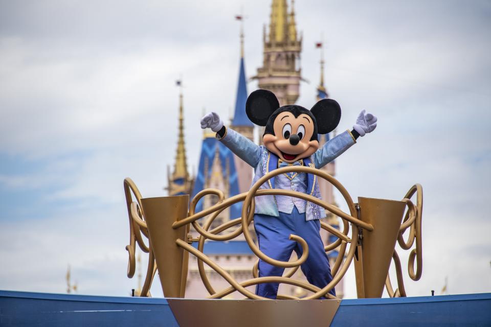 Mickey Mouse in a parade on Main Street at the Magic Kingdom Park at Walt Disney World.