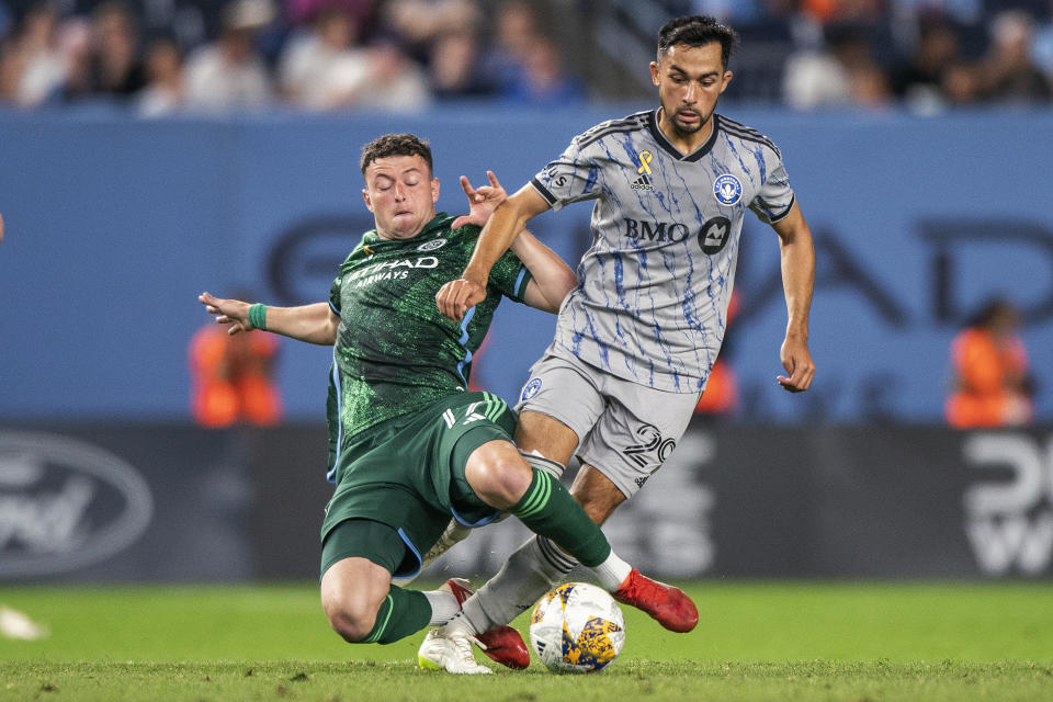 New York City FC forward Matias Pellegrini, left, vies for the ball against CF Montreal midfielder Mathieu Choiniere during the second half of an MLS soccer match at Yankee Stadium, Wednesday, Aug. 30, 2023, in New York. (AP Photo/Eduardo Munoz Alvarez)