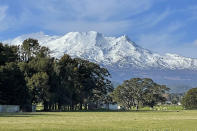 Mt. Ruapehu, an active volcano that film director Peter Jackson used as a backdrop in "The Lord of the Rings" movies, is seen from near Ohakune, New Zealand, on Sept. 20, 2022. A disastrous snow season has left two of New Zealand's largest ski fields on the brink of bankruptcy, with climate change appearing to play a significant role. (AP Photo/Nick Perry)