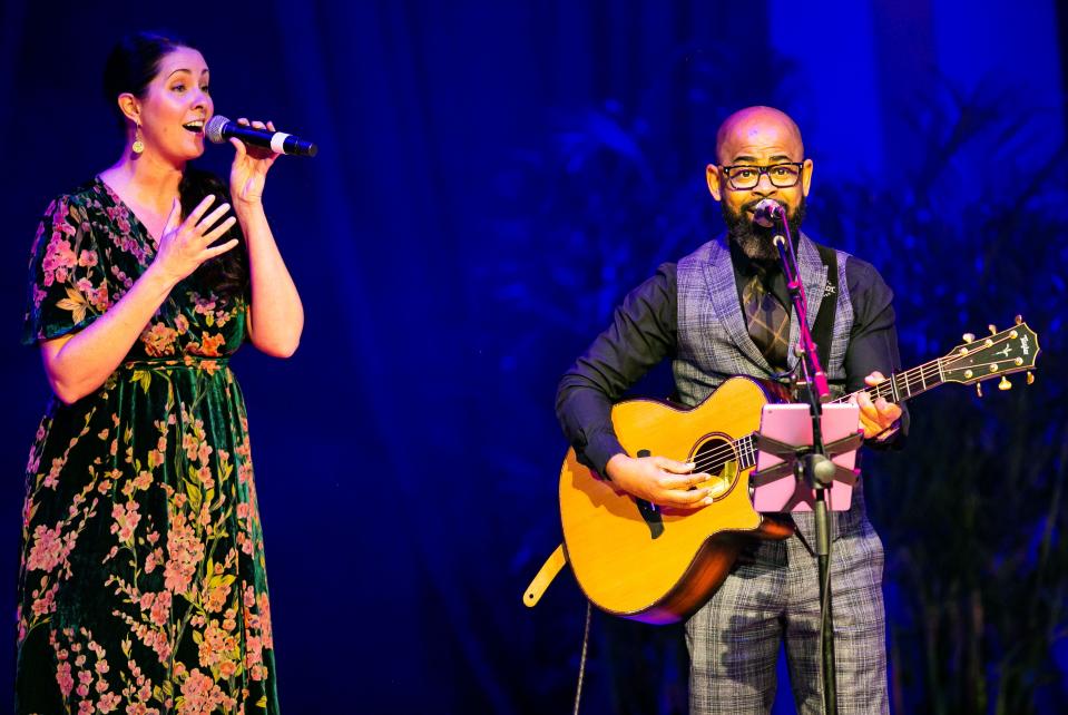 Vanguard High School IB Coordinator Stephanie DeVilling, left, a Golden Apple finalist in 2012, and Forest High School Guidance Counselor Ecliff Telford performed an inspirational song at the opening of the 32nd annual Golden Apple Gala on  Saturday night.