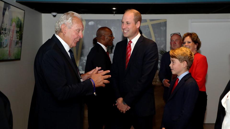 Sir Bill Beaumont, chairperson of World Rugby, meets Prince William and Prince George during the Rugby World Cup in France