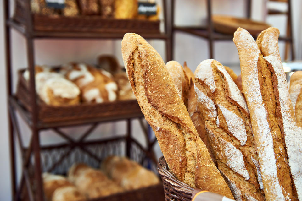 Bread baguettes in a basket in the baking shop