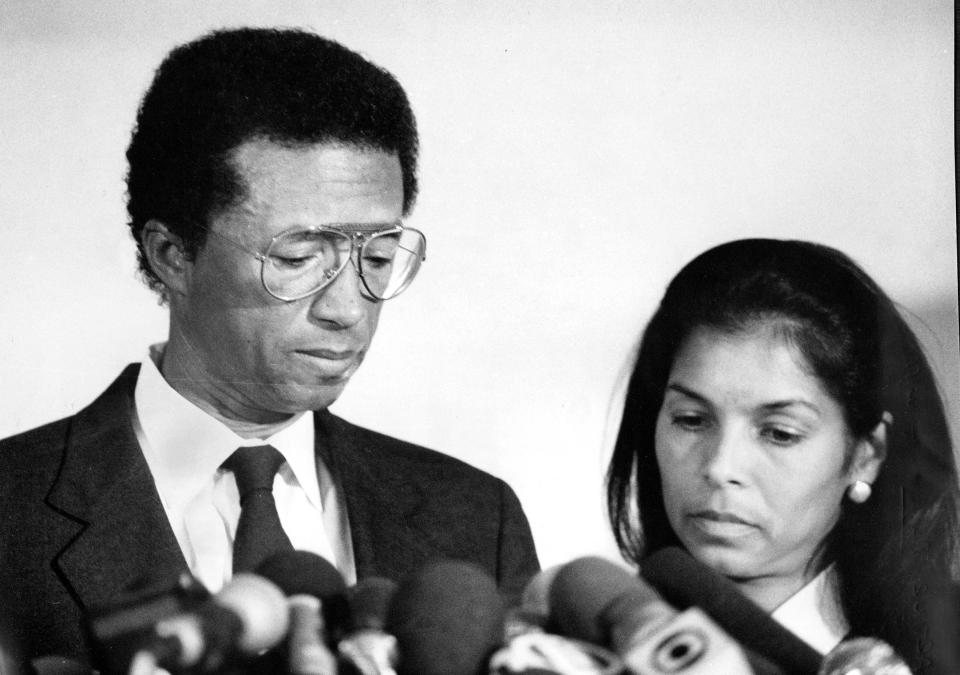 Tennis star Arthur Ashe, accompanied by wife Jeanne, announcing he contracted HIV after a blood transfusion on Apr. 8, 1992, in midtown Manhattan.
