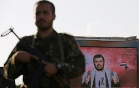 Houthi leader Abdul Malik al-Houthi delivers a speech via a TV screen during a demonstration to commemorate Ashura in Sanaa, Yemen October 12, 2016. REUTERS/Khaled Abdullah