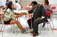 <p>Tyra Hemans, a senior from Marjory Stoneman Douglas High School, speaks with Florida Rep. Wengay “Newt” Newton, (D-St. Petersburg), during a meeting at Leon High School after the students arrived in Tallahassee, Fla., Feb. 20, 2018. (Photo: Colin Hackley/Reuters) </p>