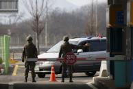 South Korean soldiers stand guard at a gateway which leads to the Kaesong Industrial Complex (KIC) at the South's CIQ (Customs, Immigration and Quarantine), just south of the demilitarised zone separating the two Koreas, in Paju, South Korea, February 11, 2016. REUTERS/Kim Hong-Ji