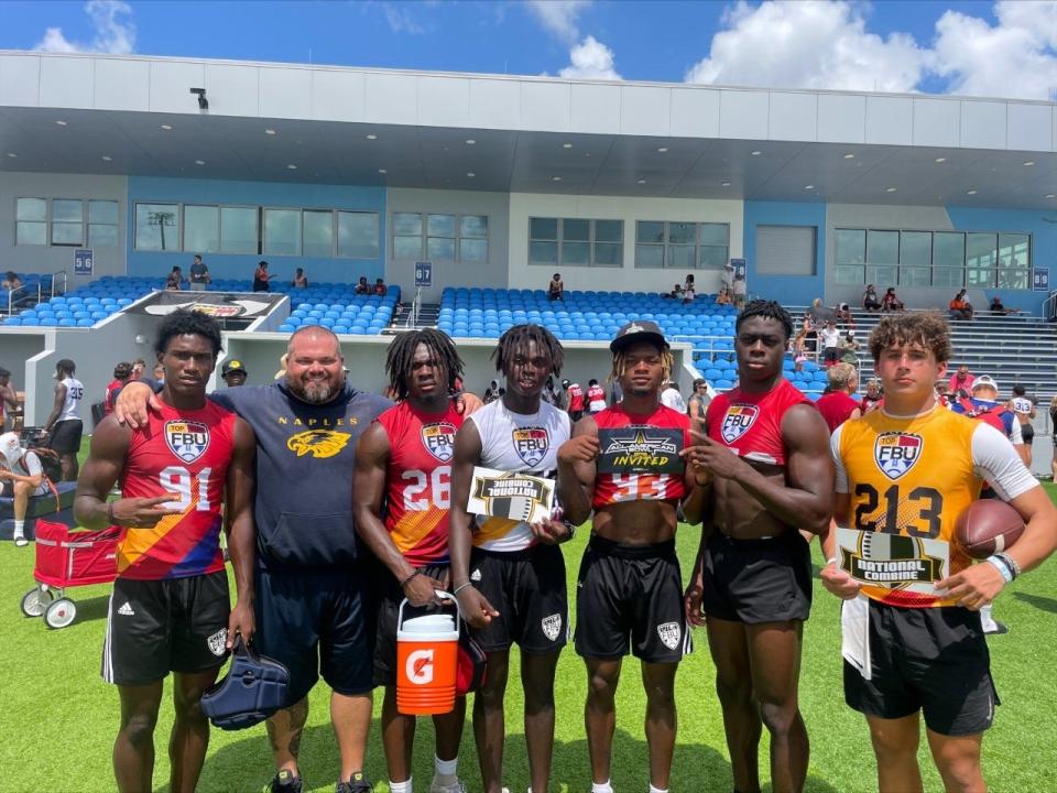 Naples football head coach Rick Martin alongside  Keylijah Williams, Kendrick Raphael, Jonas Duclona, Isaiah Augustave  and Niko Boyce after the FBU Top Gun Showcase Sunday, July, 10 at the Paradise Coast Sports Complex.