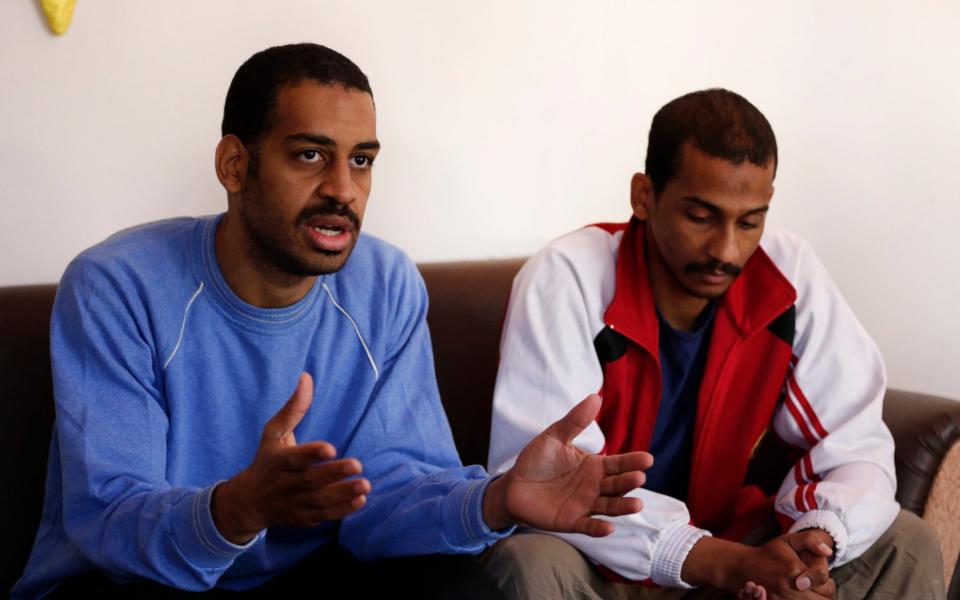 In this March 30, 2019, file photo, Alexanda Amon Kotey, left, and El Shafee Elsheikh, speak during an interview at a security center in Kobani, Syria - AP