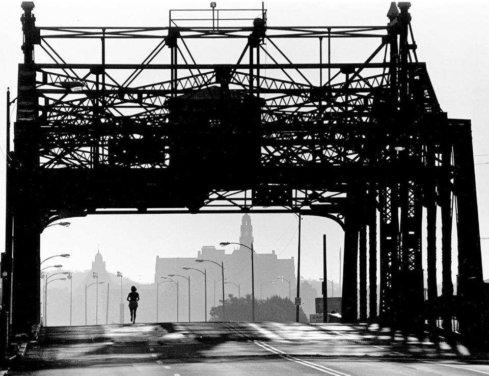 An earlly morning jogger crosses the New Bedford-Fairhaven Bridge.
Photo: July 8, 1983