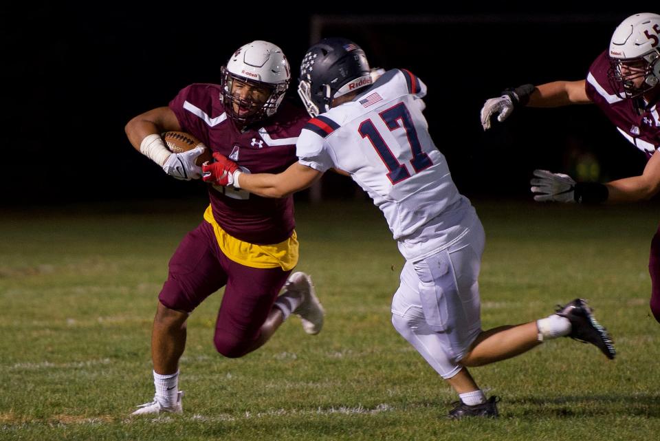 Abington running back Jaime Rivera escapes a tackle by Connor Callaghan on Friday, Sept 24, 2021. CB East won 3-0.
