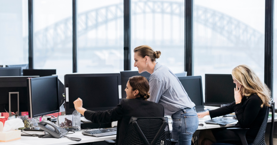 office workers with sydney harbour bridge in background