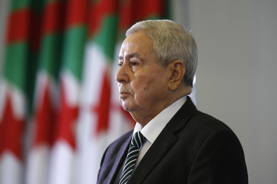 Abdelkader Bensalah stands while being named interim leader to replace former Algerian President Abdelaziz Bouteflika, in Algiers, Tuesday, April 9, 2019. As called for by the Algerian Constitution, Bensalah was named as interim leader for a maximum of 90 days until a new election can be organized. He can't run for the post himself. (AP Photo/Toufik Doudou)