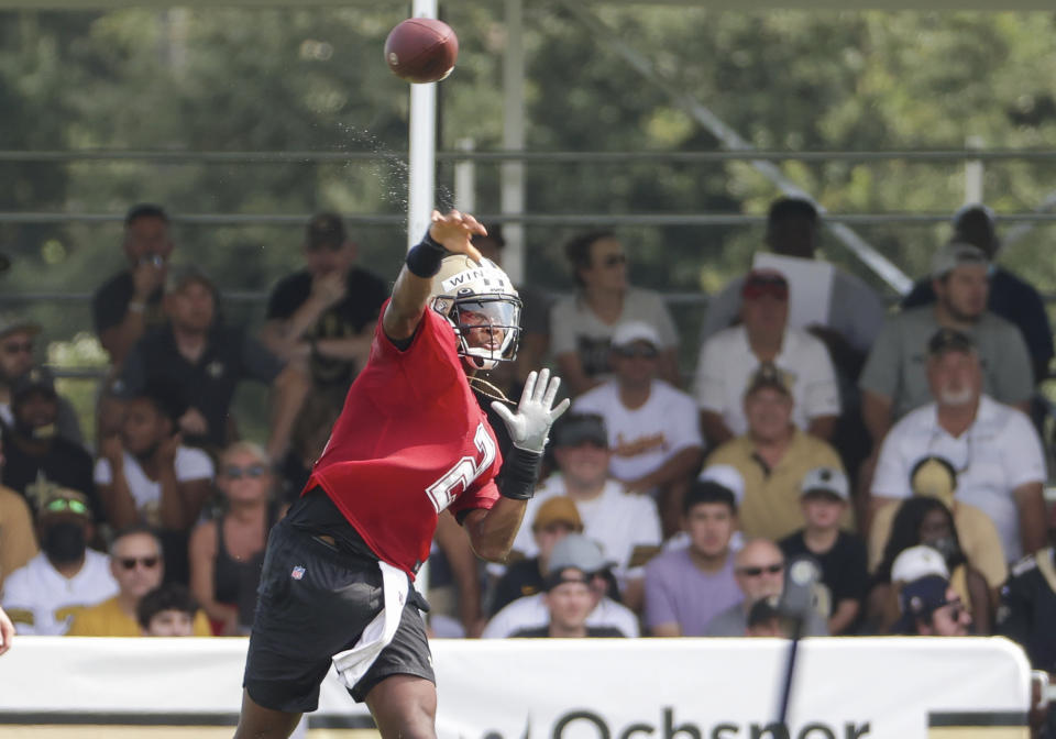 New Orleans Saints quarterback Jameis Winston (2) throws as fans watch practice from stands during NFL football training camp in Metairie, La., Saturday, July 31, 2021. (AP Photo/Derick Hingle)