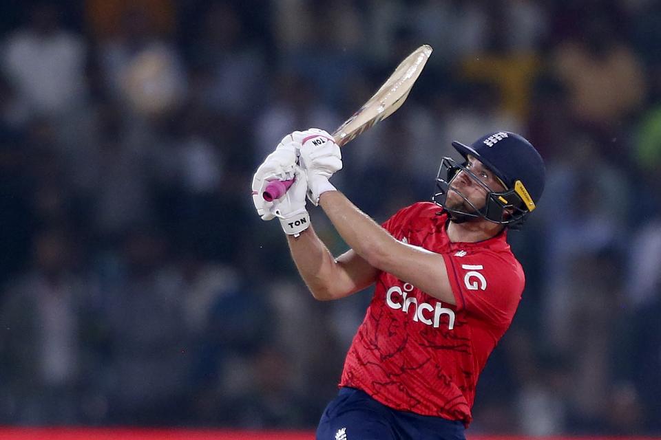England's Dawid Malan follows the ball after playing a shot for six during the seventh twenty20 cricket match between Pakistan and England, in Lahore, Pakistan, Sunday, Oct. 2, 2022. (AP Photo/K.M. Chaudary)