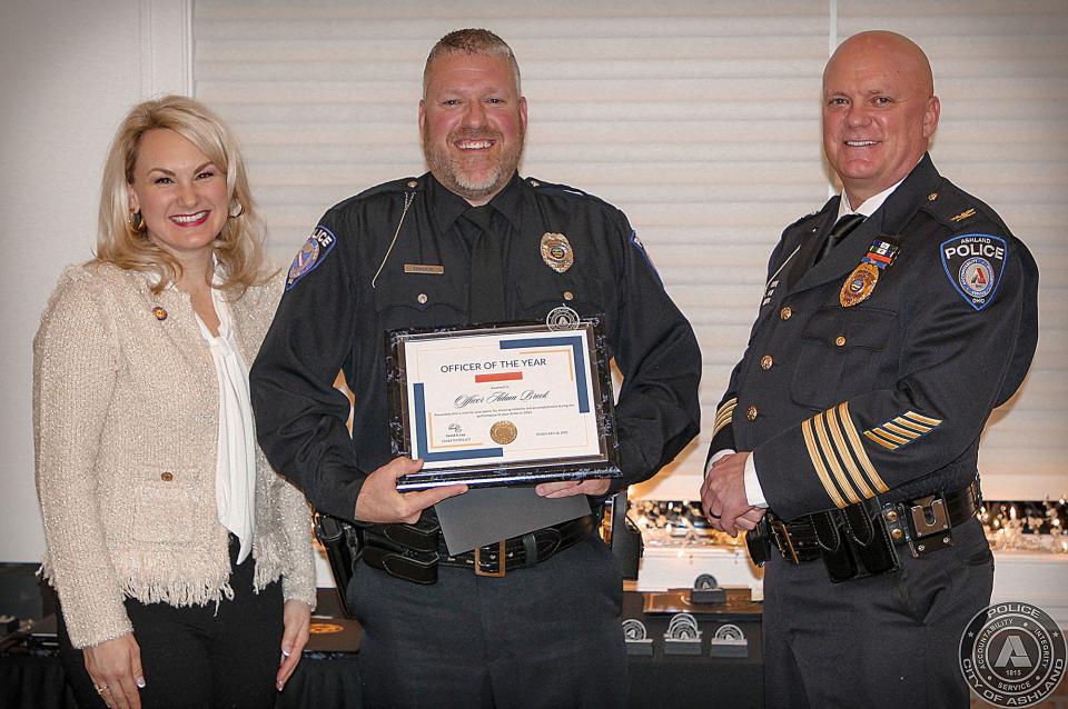 2021 Officer of the Year L to R; State Rep. Melanie Miller, Officer Adam Brock, Chief David Lay