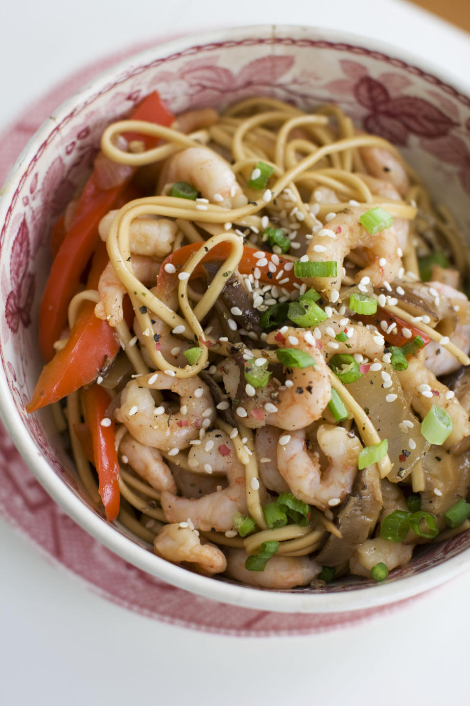 In this image taken on January 14, 2013, shrimp and shitake noodle stir-fry is shown served in a bowl in Concord, N.H. (AP Photo/Matthew Mead)