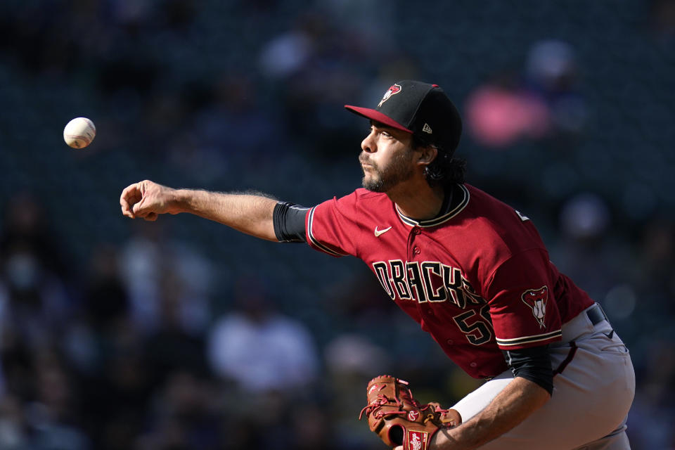 Arizona Diamondbacks relief pitcher Noe Ramirez throws against the Seattle Mariners in the eighth inning of a baseball game Sunday, Sept. 12, 2021, in Seattle. (AP Photo/Elaine Thompson)