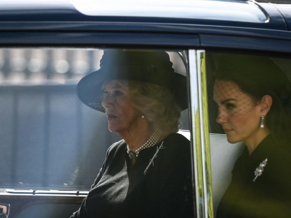 Camilla, Queen Consort and Kate Middleton, Princess of Wales are driven behind the coffin of Queen Elizabeth II.