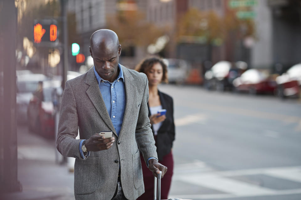 Businesspeople walking on pedestrian crossing in San Francisco