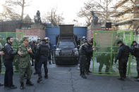 Police guard the British Embassy during an anti-UK protest in Tehran, Iran, Sunday, Jan. 12, 2020. Dozens of hard-liners later gathered outside the embassy on Sunday, chanting "Death to England" and calling for the ambassador to be expelled and for the closure of the embassy after the British ambassador was briefly arrested on Saturday. A candlelight ceremony late Saturday in Tehran turned into a protest, with hundreds of people chanting against the country's leaders — including Supreme Leader Ayatollah Ali Khamenei — and police dispersing them with tear gas. Police briefly detained the British ambassador to Iran, Rob Macaire, who said he went to the Saturday vigil without knowing it would turn into a protest. (AP Photo/Ebrahim Noroozi)