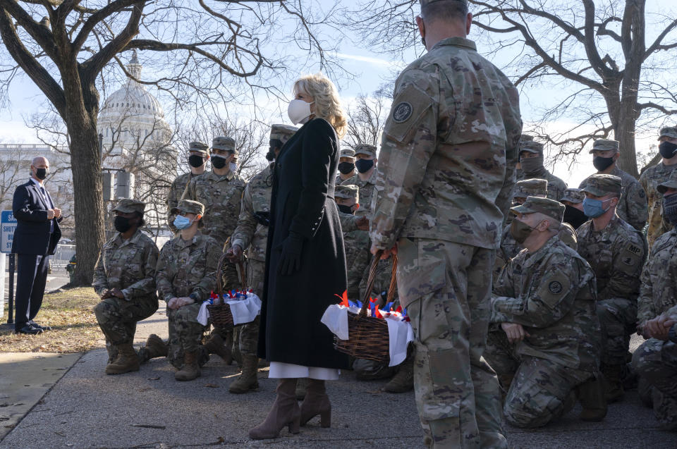 First lady Jill Biden poses for a photograph with members of the National Guard, after surprising them with chocolate chip cookies, Friday, Jan. 22, 2021, at the U.S. Capitol in Washington. (AP Photo/Jacquelyn Martin, Pool)