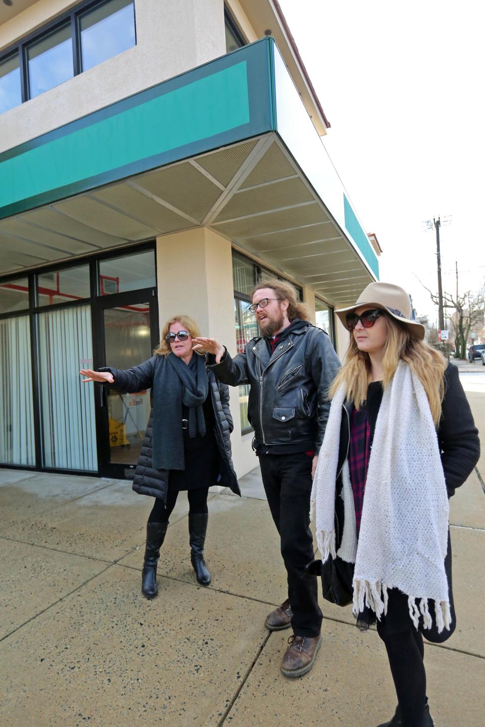 Alisa Morkides, the founder of Brew HaHa! (left), with Todd Purse and his wife Ally in 2015 discussing plans for the expanded Brew HaHa! in Wilmington's Trolley Square area.