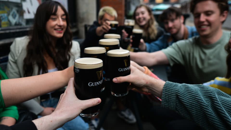 Drinking Guinness outside a pub in Dublin city center. - Artur Widak/NurPhoto/Getty Images
