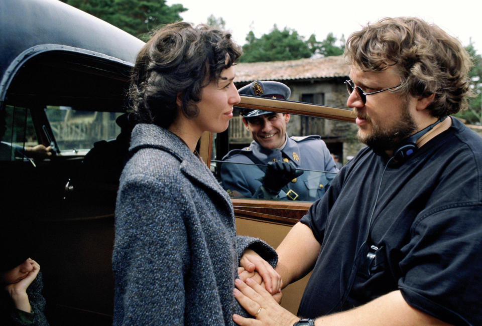 Maribel Verdu and Sergi Lopez (rear) take direction from Guillermo del Toro on the set of Pan's Labyrinth.