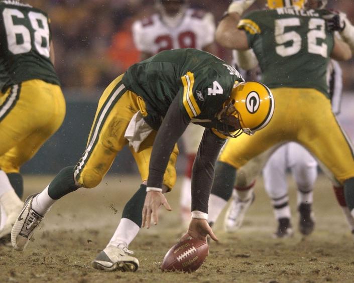 Green Bay Packers quarterback Brett Favre fumbles the ball during the fourth quarter of their game against the Atlanta Falcons Saturday, January 4, 2003 at Lambeau Field in Green Bay, Wis.