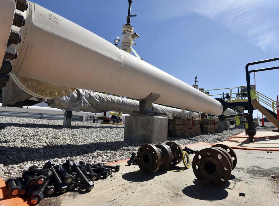 In this June 8, 2017, file photo, fresh nuts, bolts and fittings are ready to be added to the east leg of the pipeline near St. Ignace, Mich., as Enbridge prepares to test the east and west sides of the Line 5 pipeline under the Straits of Mackinac in Mackinaw City, Mich. (Dale G Young/Detroit News via AP)