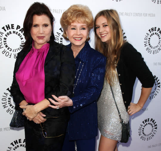 Carrie Fisher, Debbie Reynolds, and Billie Lourd pose together at the Debbie Reynolds' Hollywood memorabilia exhibit reception on June 7, 2011 in Beverly Hills, California.