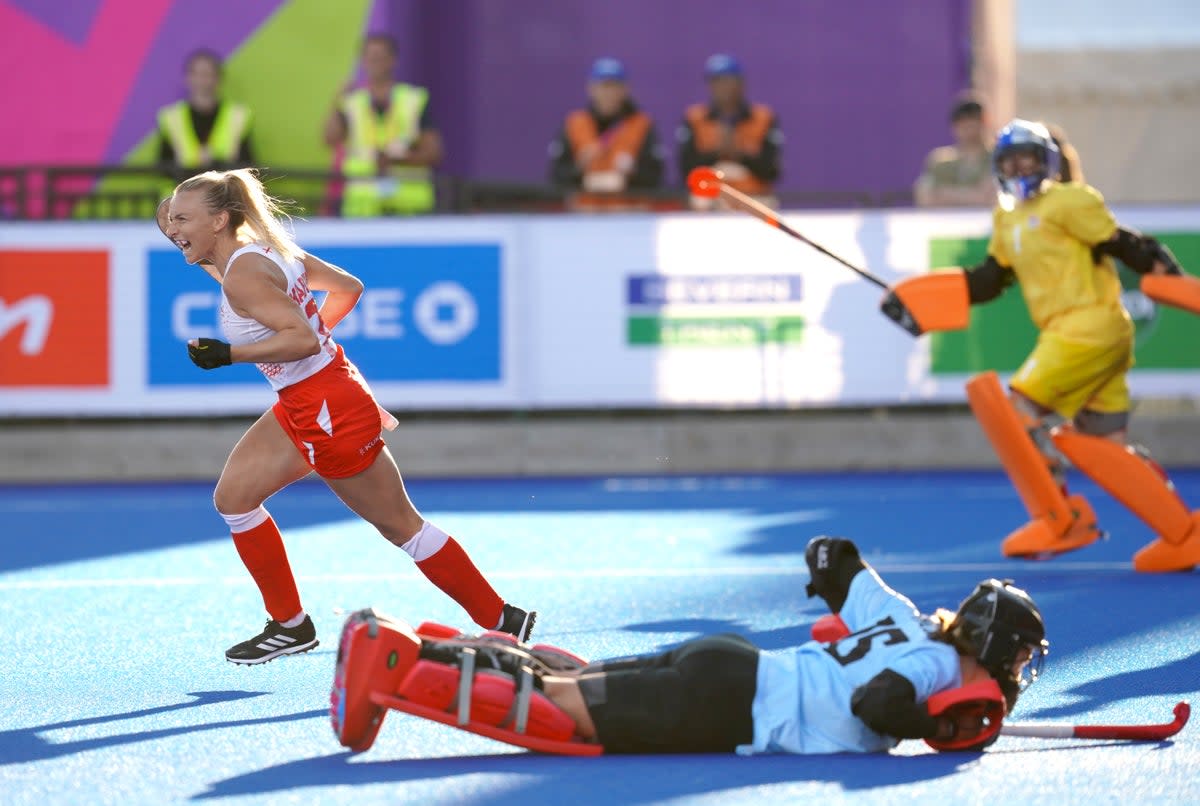 England’s Hannah Martin, left, celebrates after scoring her penalty in the women’s hockey semi-final against New Zealand (David Davies/PA) (PA Wire)