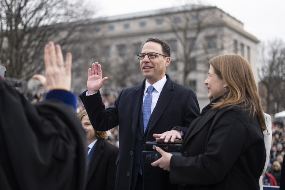 Josh Shapiro accompanied by his wife Lori Shapiro and children, takes the oath of office to become Pennsylvania's 48th governor, administered by Pennsylvania Supreme Court Chief Justice Debra Todd, Tuesday, Jan. 17, 2023, at the state Capitol in Harrisburg, Pa. Shapiro took the oath of office on a stack of three copies of the Hebrew Bible. First was an Army-issued tome carried by Herman Hershman of Philadelphia on D-Day in 1944; second is a family Bible; the third is from the Tree of Life Synagogue in Pittsburgh where a gunman in 2018 killed 11 worshippers in the deadliest antisemitic attack in U.S. history. (AP Photo/Matt Rourke)